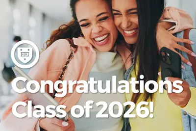 Two smiling students hugging while holding phones, with text "Congratulations Class of 2026!"