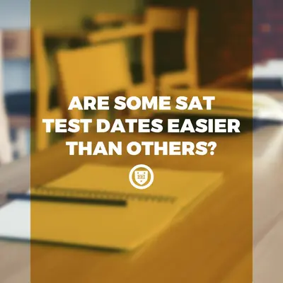 Title card over a blurred photo of a notebook and pencil on a desk: "Are some SAT test dates easier than others?"