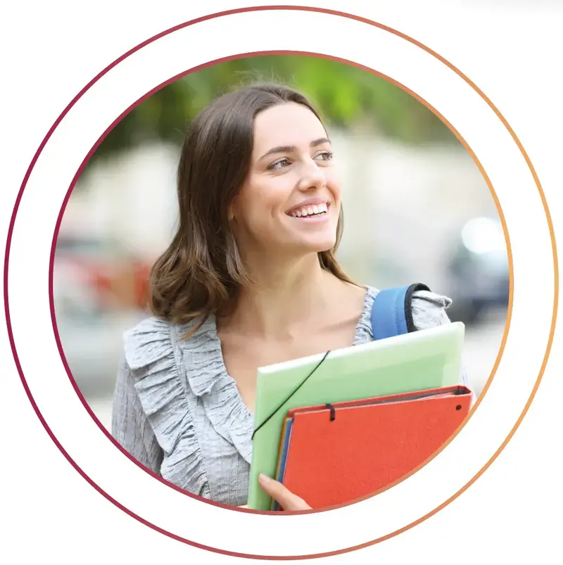 Summer internship female student holding folders outdoors