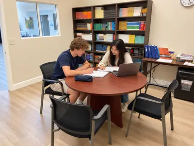 Two students studying at the Elite Learning Hub