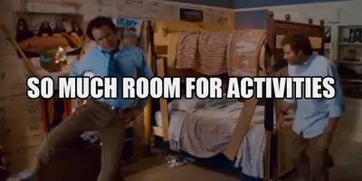 Two men celebrating beside bunk beds in a bedroom, captioned "So much room for activities"