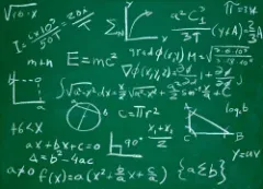 Green chalkboard covered in handwritten math formulas, equations and diagrams, including E=mc2 and a 90-degree triangle.