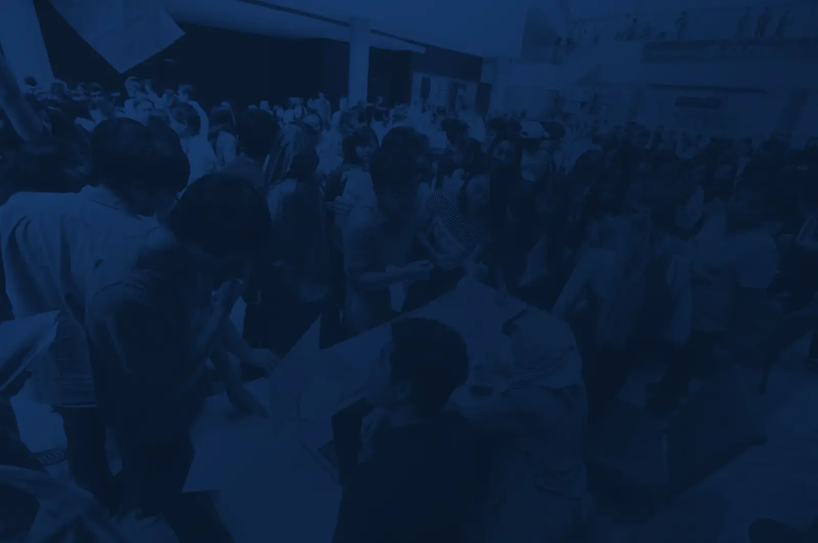 A crowd of students and parents at an Elite Vision college expo