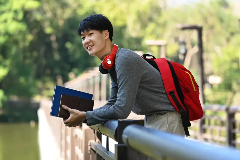 Student Leaning Over Railing