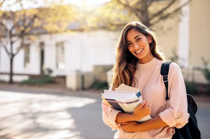 Student holding textbooks