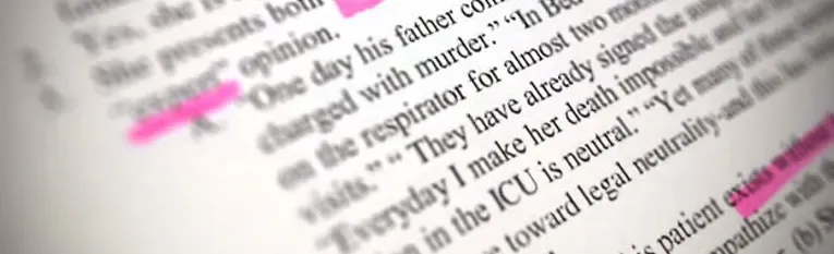 Close-up of a book page with sentences highlighted in pink, including "One day his father came home charged with murder."