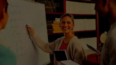 A smiling student working through equations on a whiteboard in a library
