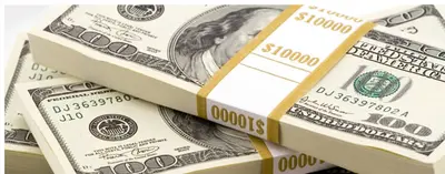 Stacked bundles of $100 bills banded with $10,000 currency straps